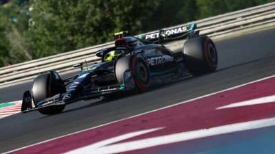 Hamilton pips Verstappen for record pole in Hungary
