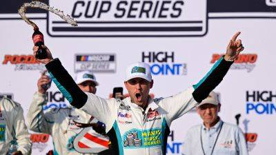 Denny Hamlin faces boos from NASCAR fans during Pocono win, irks Kyle Larson over move