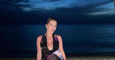 Helen Flanagan has 'bond girl' moment in plunging gown on Barbados holiday with kids after being defended