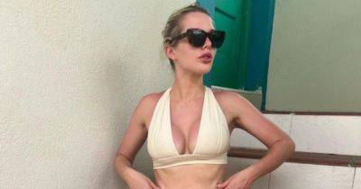 Helen Flanagan defended again as she shows off washboard abs on exotic trip before message to ex Scott Sinclair