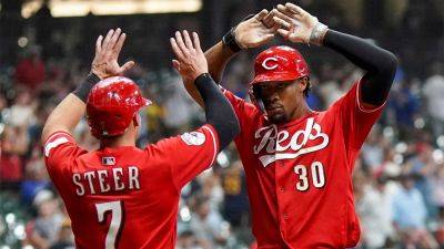 Reds survive ninth-inning surge from Brewers to move within half-game of NL Central lead - foxnews.com