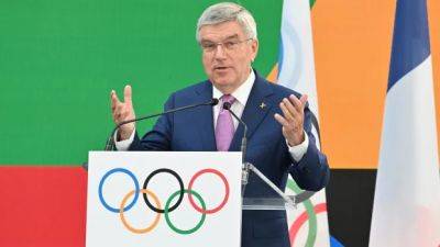 Thomas Bach - Star - Olympic president invokes John Lennon's memory as Paris marks 1-year countdown to war-clouded Games - cbc.ca - Russia - France - Ukraine - Belarus