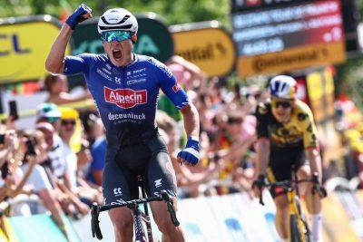 Jasper Philipsen sprints to victory at Tour de France as Adam Yates retains yellow jersey