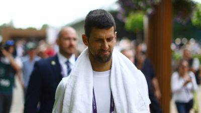 Djokovic, Swiatek shine in the rain as Wimbledon gets rolling