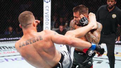 Justin Gaethje knocks out Dustin Poirier, wins BMF title at UFC 291 - ESPN