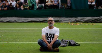 Just Stop Oil protestors disrupt play at Wimbledon after running onto court