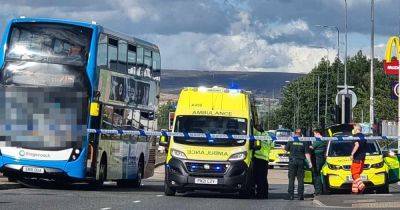 Police cordon off main road beside retail park after cyclist hit by double decker bus - live updates - manchestereveningnews.co.uk