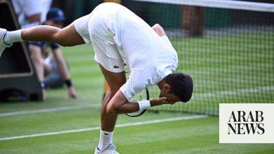 Djokovic, Swiatek triumph at Wimbledon as confetti-throwing protesters strike
