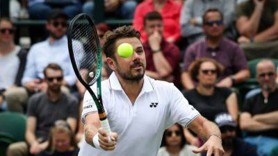 Wawrinka hopes to 'not get killed' by Djokovic at Wimbledon
