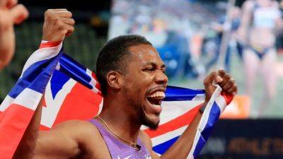 Record-holder Hughes runs to British title in lashing rain - channelnewsasia.com - Britain - Hungary - Jamaica