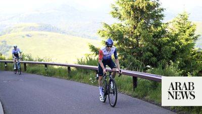 Michael Woods secures big win at top of famed Tour de France mountain as Pogacar closes gap on Vingegaard