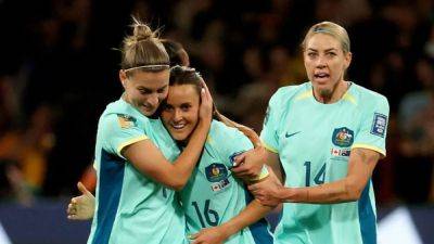 Australia crush Canada 4-0 to reach World Cup knockouts