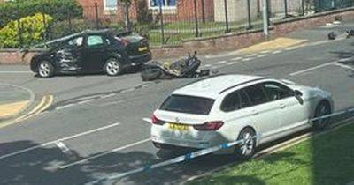 Emergency services rush to scene of crash involving car and motorbike - as two people hurt