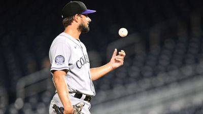 Braves get reliever Brad Hand from Rockies for minor leaguer - ESPN