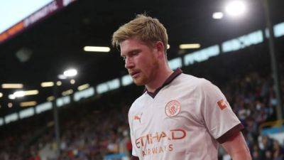 Man City win at Burnley marred by injury to De Bruyne