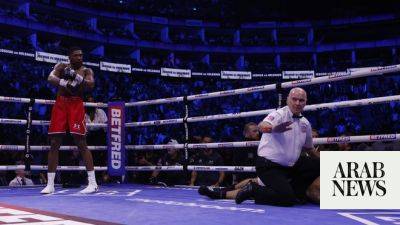 Joshua knocks out Helenius in 7th round after earlier jeers from fans