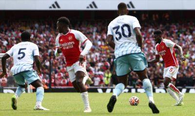 Arsenal survive Forest scare to make winning Premier League start