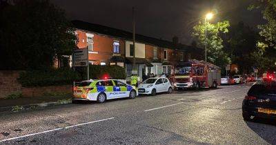 House taped off with 'smashed windows' after 'explosion' in Bury