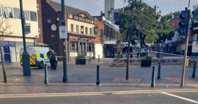 Huge cordon in place in town centre as woman rushed to hospital after reports of violent assault