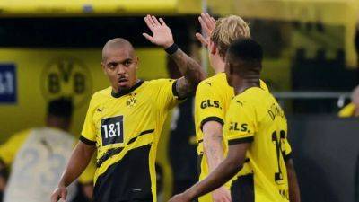 Dortmund's Malen scores last-gasp winner over Cologne in season opener