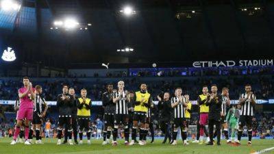 Man City see off Newcastle, Man Utd lose at Spurs