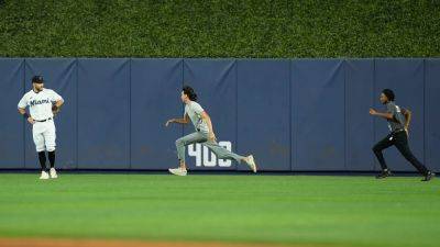 Marlins field invader out-maneuvers security in the outfield as team falls to Phillies