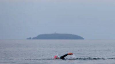 Two men die during swimming portion of Ironman event in Ireland