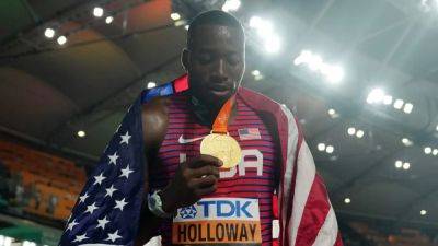American Holloway wins third straight world 110m hurdles title