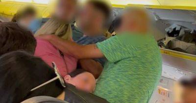 'If you can't handle it, don't drink...' Video captures 'drunk' woman brawling with Ryanair passenger on flight to Ibiza