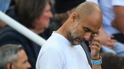 Man City manager Guardiola to miss two matches after back surgery