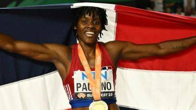 Sydney Maclaughlin - Paulino becomes first Dominican woman to win a world title - channelnewsasia.com - Usa - Poland - Barbados - Dominican Republic - Dominica