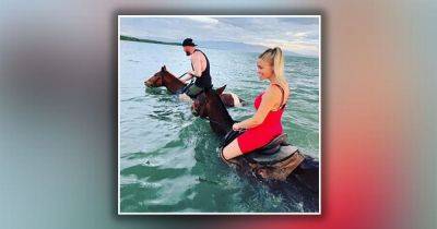 Killer couple pictured riding horses in the Caribbean Sea after they fled to the sun in wake of murder