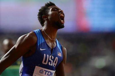 Lyles into final of world 200m despite golf buggy collision