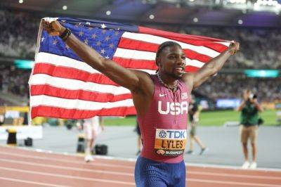 Lyles wins third 200m title for rare world sprint double