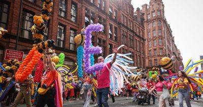 Rain can't stop the celebrations as thousands line the streets for a massive Manchester Pride parade