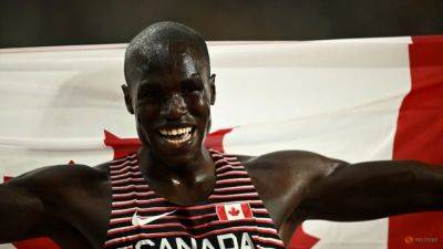 Arop goes from back to front to take 800m gold