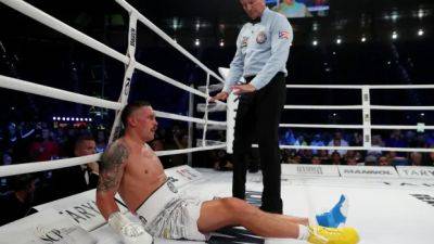 Controversial low-blow call helps Usyk come back to KO Dubois, retain heavyweight titles