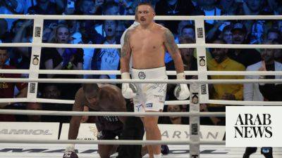 Low-blow call helps Usyk come back to KO Dubois and keep heavyweight boxing titles