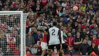 Arsenal held to 2-2 draw by 10-man Fulham