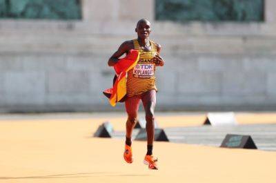 Uganda's Kiplangat wins men's world marathon title