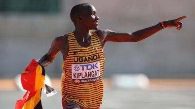 Uganda's Victor Kiplangat pulls away late to win men's marathon on last day at worlds