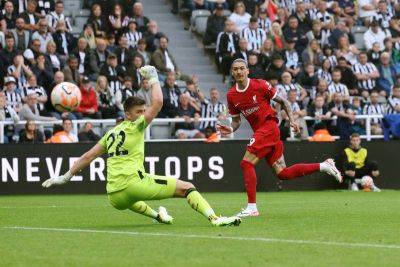 Darwin Nunez hits late double to help 10-man Liverpool to victory at Newcastle