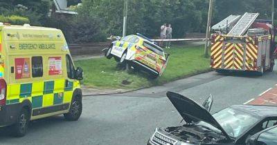 Police officers escape unharmed after GMP car slams into pole during crash