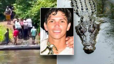 Soccer player dies from killer croc encounter while trying to cool off in river