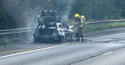 Huge delays on M56 after BMW bursts into flames with emergency services at scene - live updates