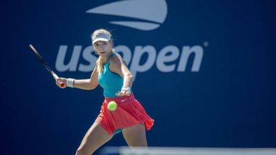 Katie Boulter recovers from a set down to progress
