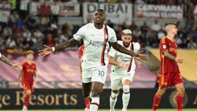 Ten-man Milan grab 2-1 win at Roma