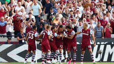 West Ham top Premier League table with win at Luton