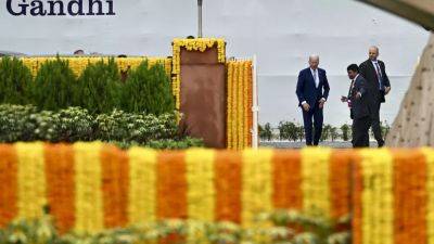 G20 leaders pay respects at Gandhi memorial as they wrap up Indian summit and hand over to Brazil