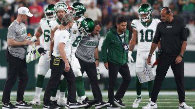 Aaron Rodgers - Robert Saleh - Zach Wilson - Aaron Rodgers injures ankle on opening drive of Jets debut - ESPN - espn.com - New York - state New Jersey - county Rutherford